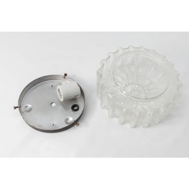 Round glass ceiling light from the 1960s with a ceramic bulb holder. It is in very good condition and looks superb with...