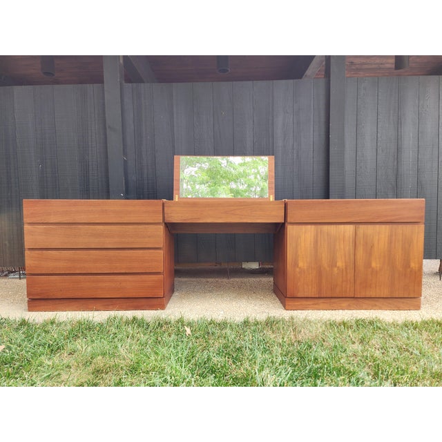 An exceptional example of Danish Modern craftsmanship, this authentic Arne Wahl Iversen for Vinde Møbelfabrik teak vanity...