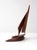 Bring mid-century modern style and nautical flair to your space with this vintage wooden sailboat sculpture. Featuring...