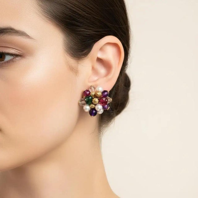 These vintage 1980s Italian clip-on earrings are a vibrant celebration of maximalist design, featuring a lush, cluster-...