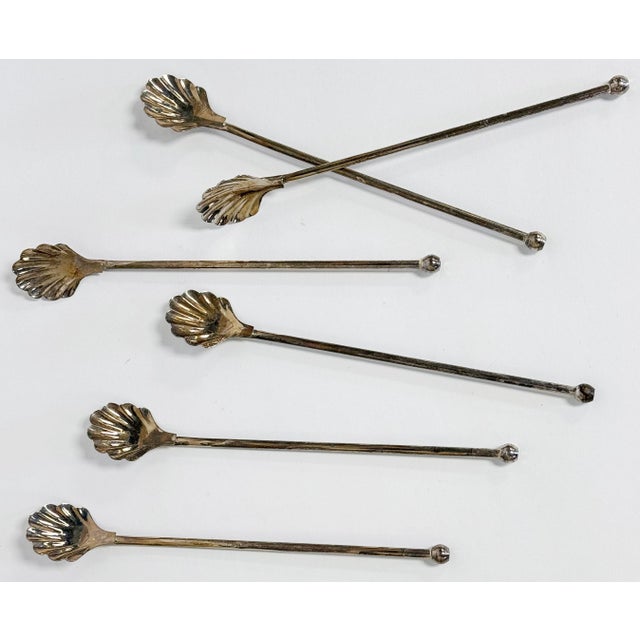 Vintage set of six (6) long silver-plate iced tea or cocktail stirring spoons featuring classic shell motif. Gorgeous...