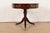 A gorgeous Georgian or Regency style pedestal drum side table or tea table By Baker Furniture USA, Circa 1980s Flame...
