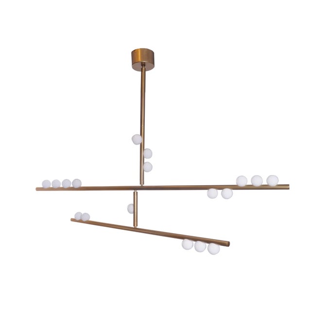 The 18 Bulb Drop System DS.15.01 by Lindsey Adelman brings sculptural balance and warm, modern character to any interior,...