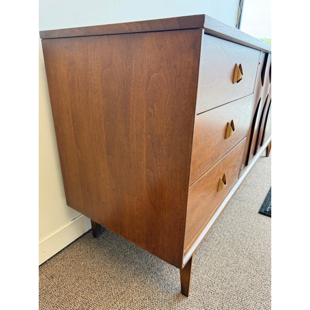 Offering a beautiful 1960’s MCM walnut nine drawer dresser / credenza by Broyhill from their Brasilia line. Introduced in...