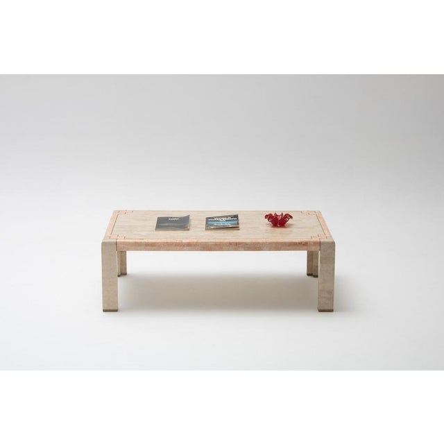 Vintage coffee table with a tessellated marble top in off-white and salmon tones and brass details, clearly inspired by...