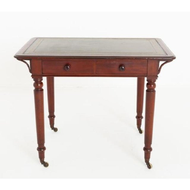 Mahogany 2 drawer writing table. Circa 1870 This writing table comes with the makers mark of Holland and Sons The writing...