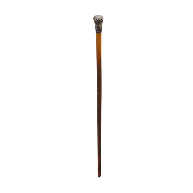 This antique Victorian presentation walking cane is crafted from solid oak and showcases exceptional historical character...