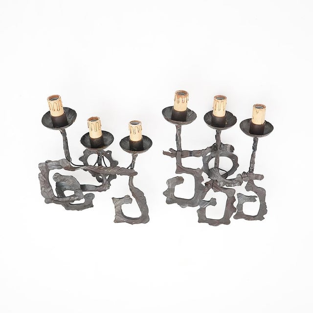 Sculptural and strongly textural, this pair of Brutalist wrought iron wall sconces dates to the 1960s, a period when...