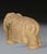 An unusual early 20th Century sculpted terracotta elephant. Stylistically modelled with Indian headdress and rugs on his...