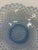 Vintage blue opalescent Fenton glass bowl featuring a raised hobnail pattern, scalloped ruffled rim, and circular footed...