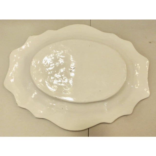 French vintage faience tray in the very popular 18th-century style. The scene is a boy by the shore in the fishing mode, a...