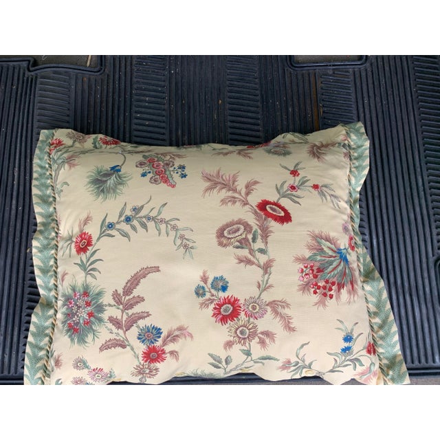 Large vintage pillow . Yellow with green pattern on one side floral on the other. Yellow button closure. Measuring 21”...