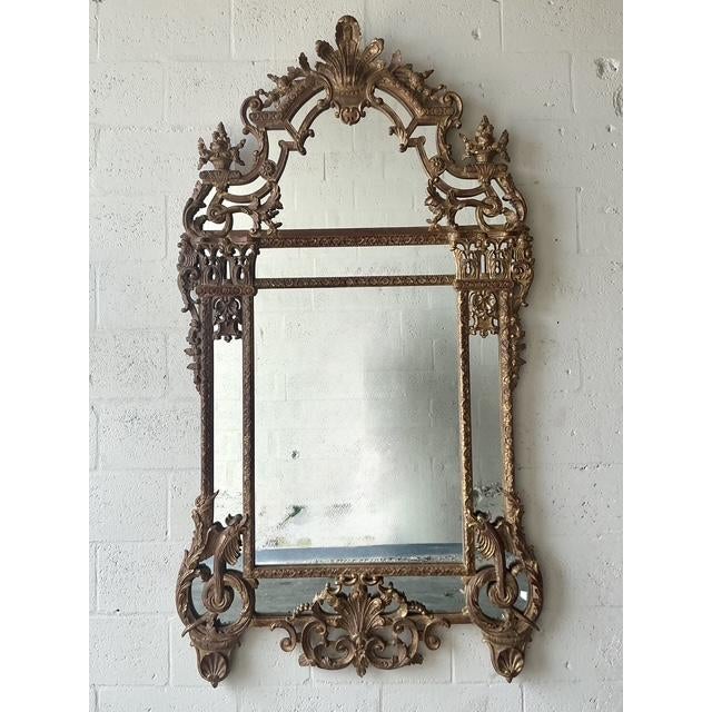 Elevate your interior with this magnificent Vintage Hollywood Regency Giltwood Plume Mirror, a true testament to opulent...