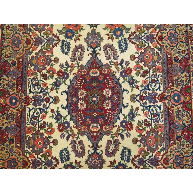 An intermediate size persian Kashan rug in full pile excellent condition. This rug has been in our family since 1918. It...