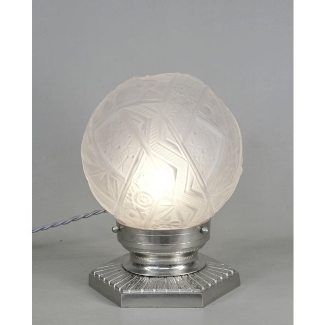 H. Petitot & Muller frères A wonderful French 1925-1935 art deco table lamp in nickel plated bronze or solid brass. The...
