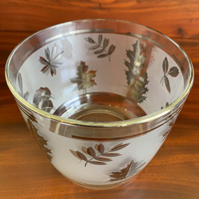 A beautiful vintage Libbey's Silver Leaf Ice Bucket to help you entertain in elegant mid century style. In the 1963...