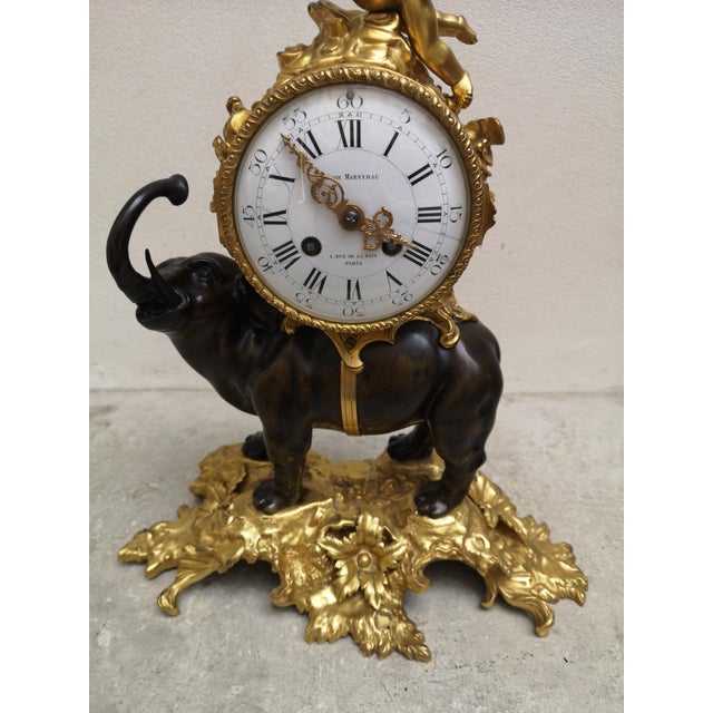Antique French Bronze Mantel Clock Gold pendulum clock Desk clock Elephant decor Angel statue 19th-century France. Signed...