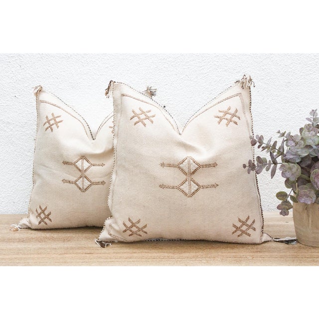 Introduce a harmonious touch of organic Moroccan artistry to your home with this exquisite pair of handcrafted cactus silk...