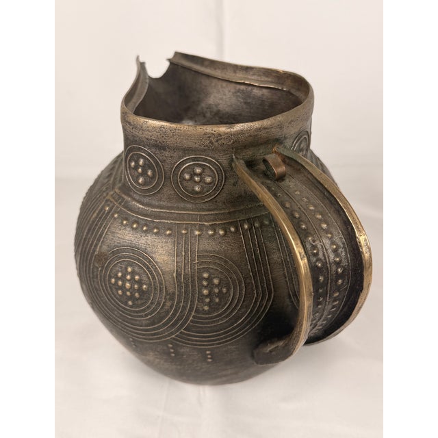 An unusual West African cast bronze or brass pouring vessel, likely Nigerian and in the Benin metalworking tradition. Of...
