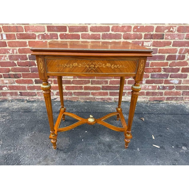 Vintage Louis XvI Style Marquetry Stretcher Base Brass Mounted Floral Inlaid Card Table Featuring embossed green leather...