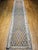 This authentic flat-woven Persian Qazvin kilim features an all over geometric pattern inspired by stylized flower buds,...