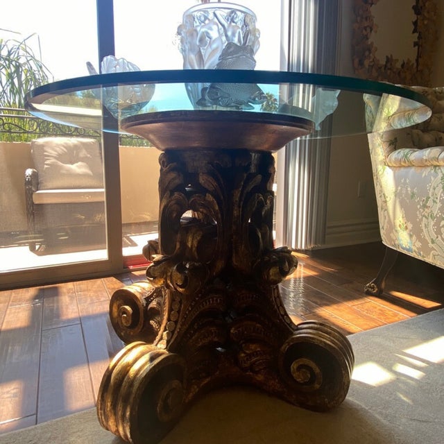 Behold a gorgeous vintage glass Hollywood Regency-style table with a Corinthian-style wood base. Sold as a set, it comes...