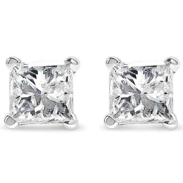 Celebrate any occasion with these classic shimmering diamond stud earrings. Crafted from 14k yellow gold each earring...