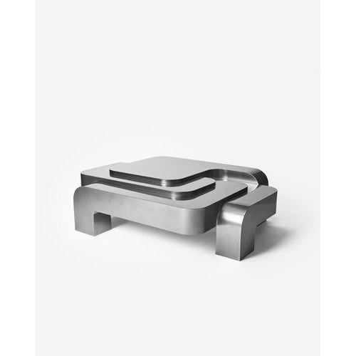 Automa coffee table in liquid metal finish by pietro franceschini. Dimensions: w 140 x l 104 x h 40 cm. Materials: liquid...