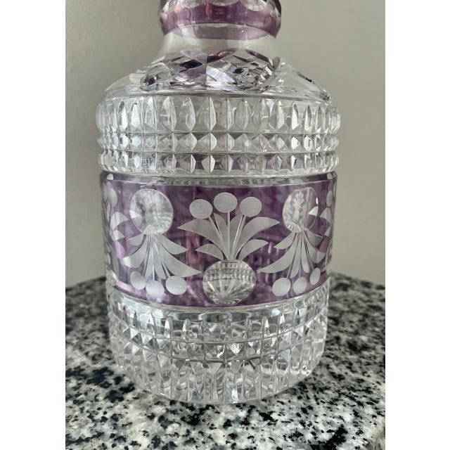 Amethyst color & diamond cut crystal and etched pattern decanter. This piece can be used as barware or a decorative...