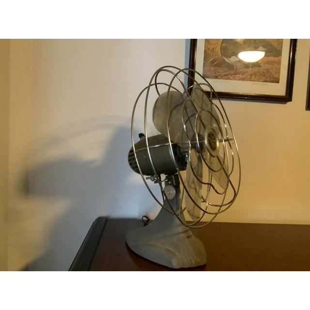 Add an authentic touch of mid-century industrial utility to your space with this classic Manning Bowman model 51 desk fan,...
