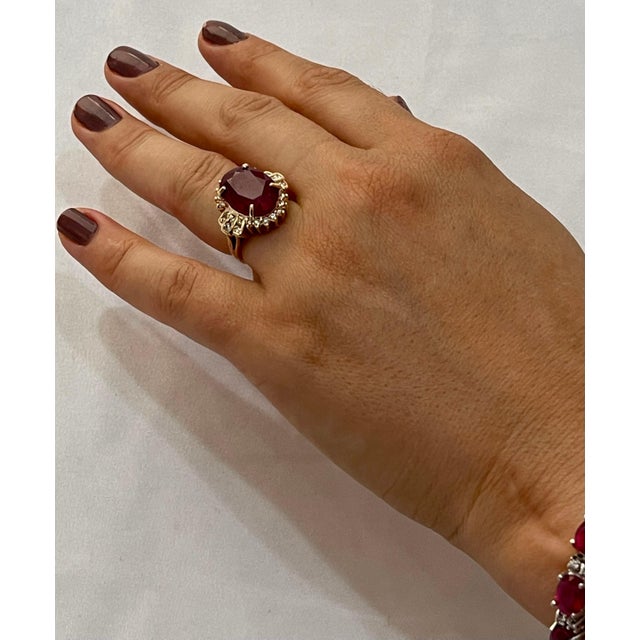 16 X11 Oval Cut Approximately 12.28 Carat Treated Ruby 14 Karat Yellow Gold Ring Size 6 Diamond Brilliant cut...