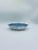 A decorative vintage bowl made of high-quality ceramic. The bowl features a distinctive star-shaped design, adorned with a...