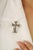 This elegant yellow sapphire and diamond cross brooch pendant is crafted in 925 sterling silver, featuring a Victorian...