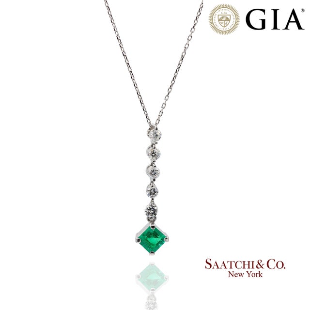 GIA Platinum 900 Natural Diamond and Emerald Pendant Metal Type: 900 Platinum Total Item Weight: 2.7 Grams Sizable: Yes...