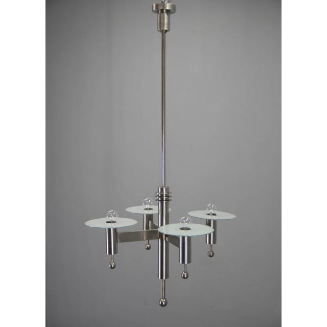 An exceptionally eye-catching rare machine age chandelier, showcasing industrial glamour through its striking geometric...