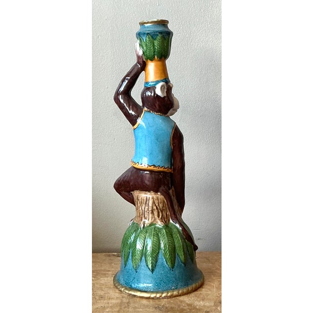 Inject a dose of whimsical sophistication into your decor with this charming vintage ceramic monkey candlestick. A...