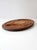 Vintage 1960s teak carving board with a generous oval form, deeply carved juice groove, and sculptural wells at either...