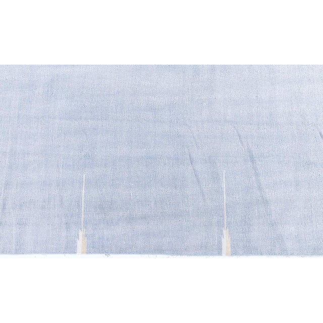 This refined 1945 Indian Dhurrie rug is a beautiful example of mid-20th-century flat-weave craftsmanship, celebrated for...