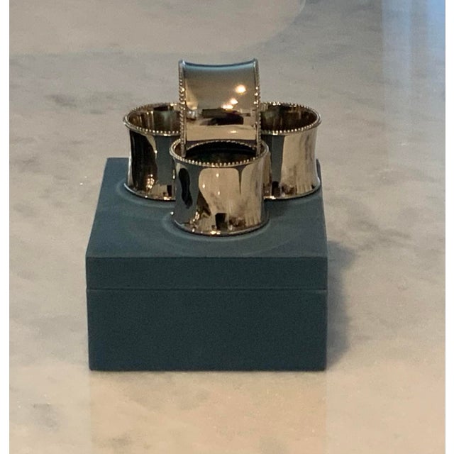 A set of 4 unused Towle silverplate napkin rings in their original box. Many purchase these for monogramming. This set is...