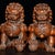 Beautiful matching pair of hand‑carved Chinese boxwood foo dogs (guardian lions). Traditional auspicious symbolic figures...