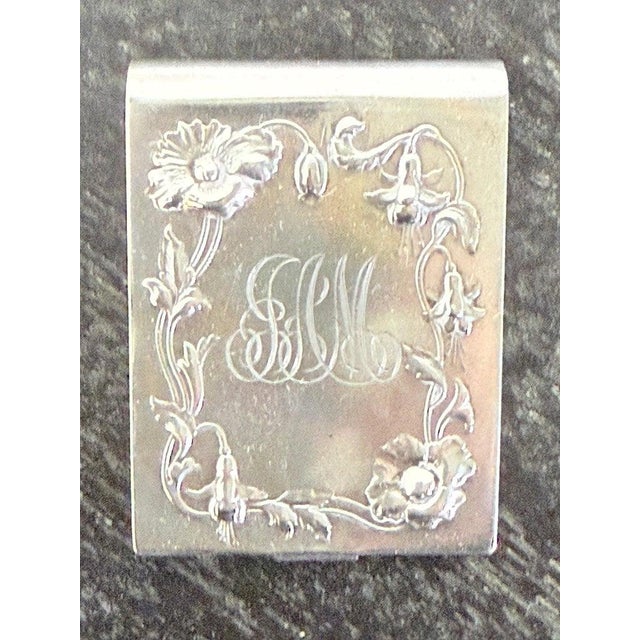 This antique sterling silver match safe, also known as a vesta case, is a finely crafted example of Art Nouveau design...