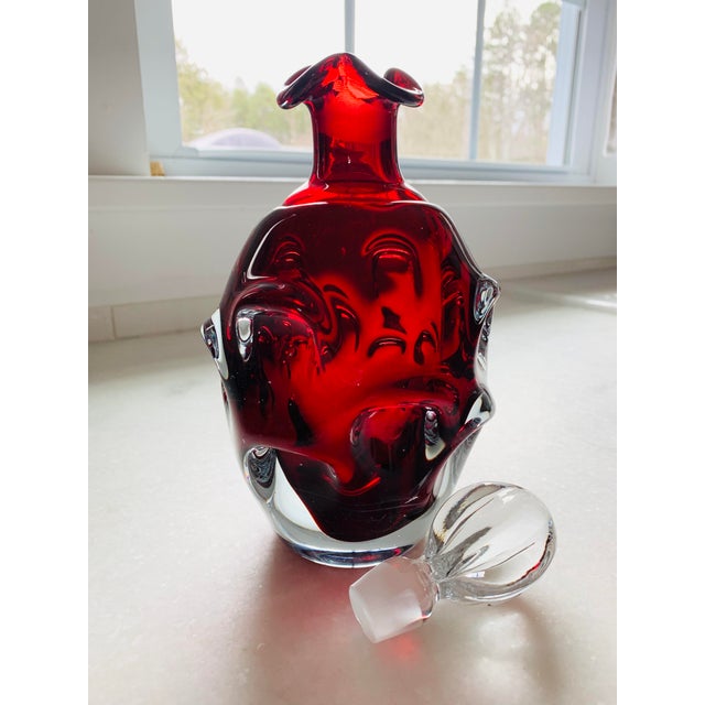 This amazing sculptural Hand Blown Sommerso Ruby glass Decanter by Bo Borgstrom for Aseda Glass in Glasbruk Sweden is an...