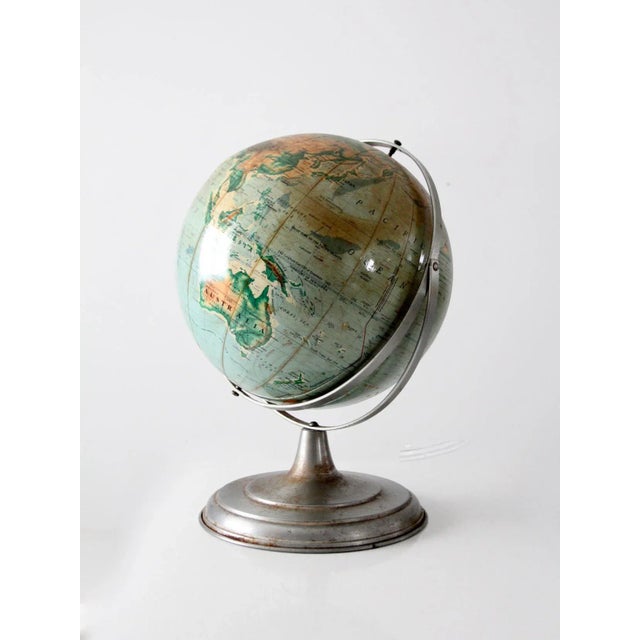 1960s Nystrom 16 inch pictorial relief globe featuring raised topography and colorful illustrated cartography. This large...