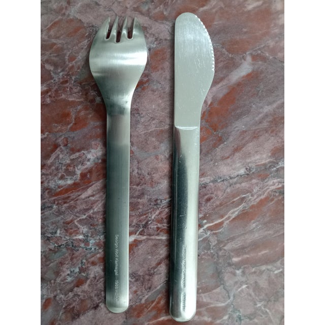 18-piece steel fork and knife set by Wolf Karnagel for the German airline Lufthansa, 1980s. This piece has an attribution...