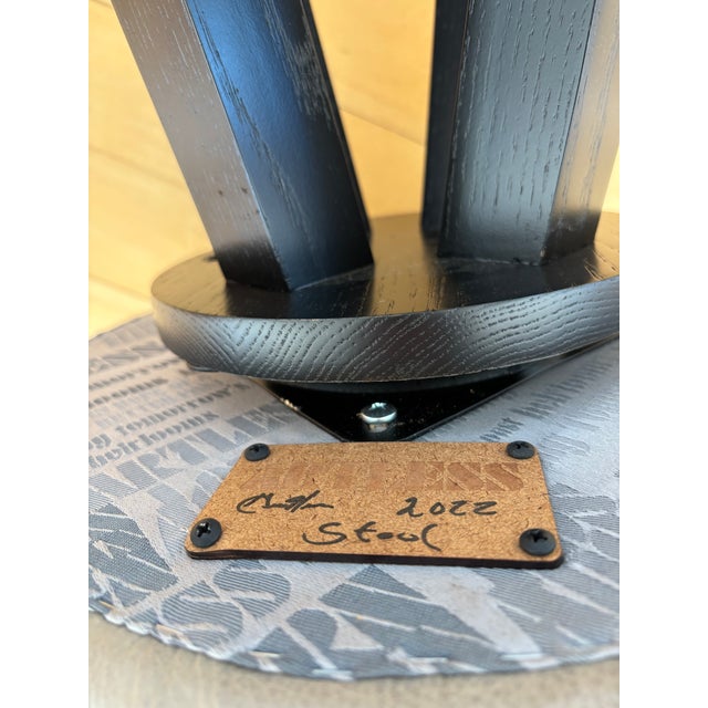 Four Artless X3 Swivel Bar Stools are a high-end modern seating option designed and hand-built in Los Angeles, featuring...