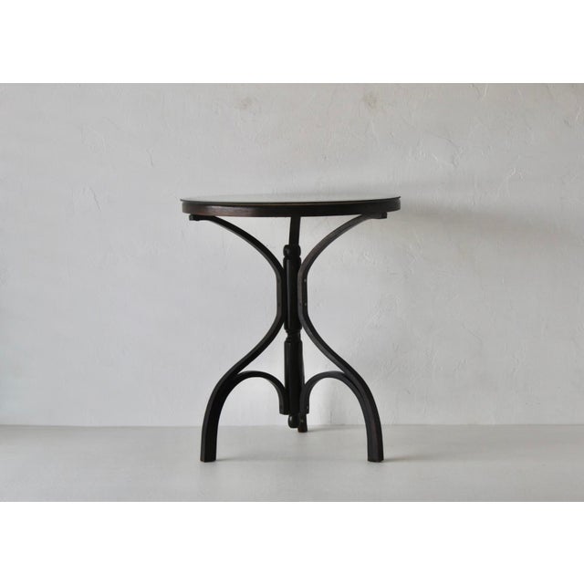French-style Bergère top accent table, featuring a woven cane inlaid into the surface of the tabletop, topped with beveled...
