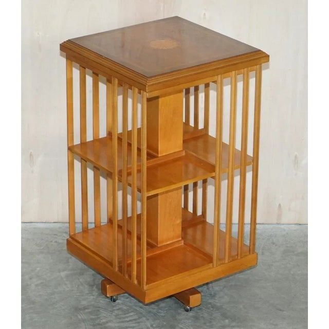 A stunning vintage Sheraton Revival burr Yew & Satinwood revolving bookcase table A very good looking well made and...