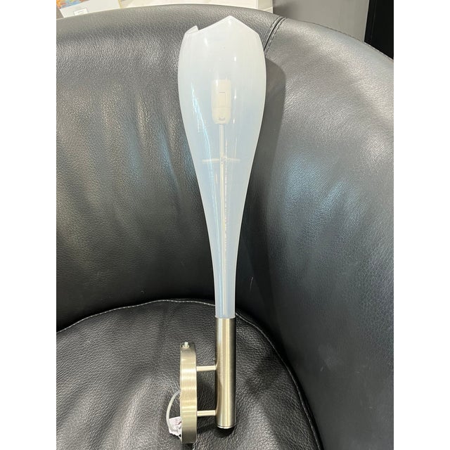This is a very beautiful and simple wall sconce from the furnaces of Murano. Blown glass made into the shape of a tulip!...