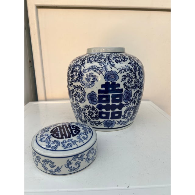 This item is a 9-inch blue and white ginger jar featuring a traditional "Double Happiness" symbol and floral pattern Great...