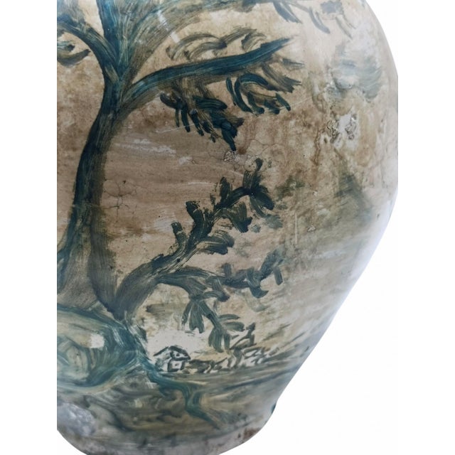 A majolica ceramic storage jar or flask dating from the 19th to the early 20th century, associated with the folk pottery...
